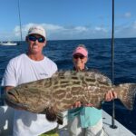 2020 - Laura Hendrick and captain Shawn Albury with a nice black grouper on “Free Spool”