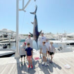2022 - Frank Masse & James Mullen landed this swordfish on "Shark Bait" and some boys from Reef Club Kids excited to see the fish.